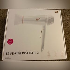 T3 Featherweight 2 hair dryer. Gently used. White with rose gold details.